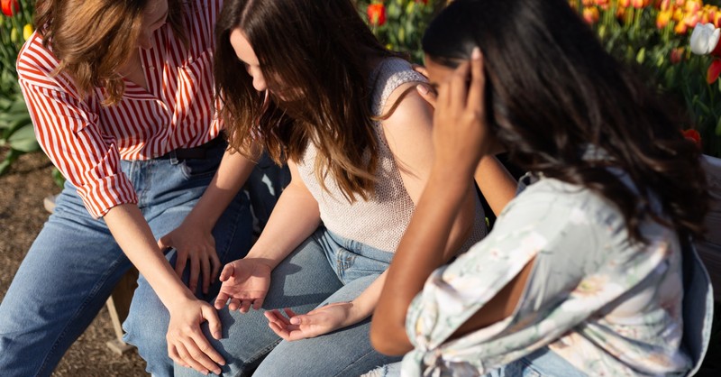 woman praying together -trusting gods plan 