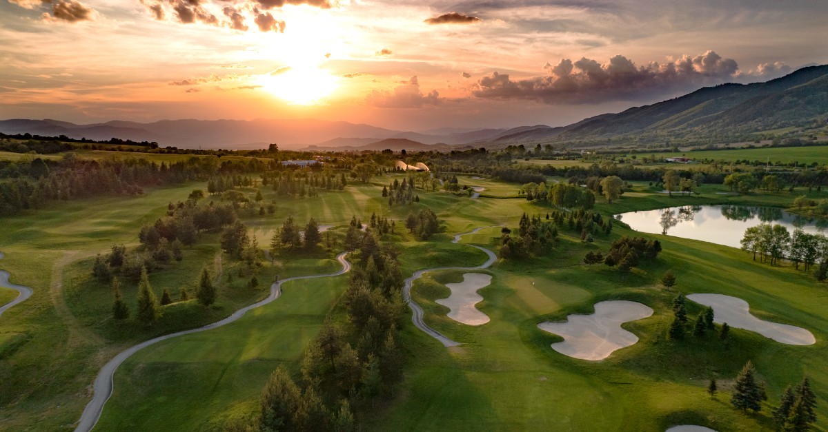 A golf course laid out at sunrise