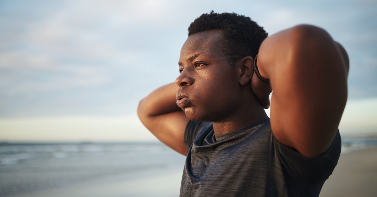 Person on a beach breathing in and out